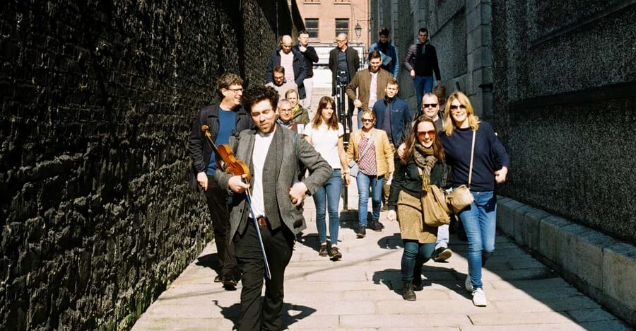 Dublin: Irish Music Walking Tour with Live Performance - Getting set for the tour at The Old Storehouse (green umbrella)