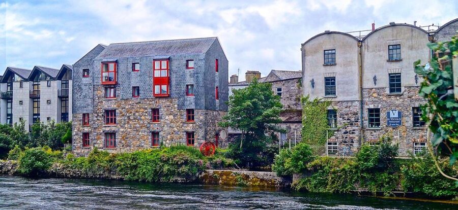 Galway City: Guided 1.5-Hour Walking Tour - Eyre Square tales: merchant families, invaders, presidents, movie stars