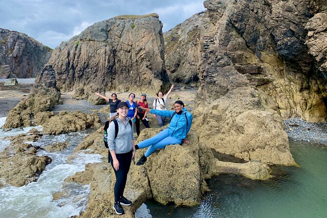 Howth Safari Hiking Tour - Baily Lighthouse: red rock breaks, sea caves, and erosion by the sea